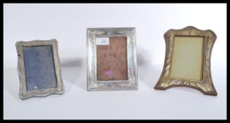 Three silver picture frames to include a 20th cent