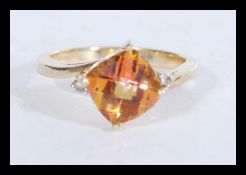 A hallmarked 9ct gold ring set with a central topa