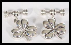 A pair of sterling silver cufflinks cuff links in
