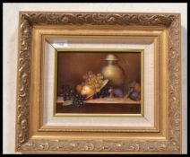 A 20th century continental school oil on board painting -  still life study of grames and pewter jug