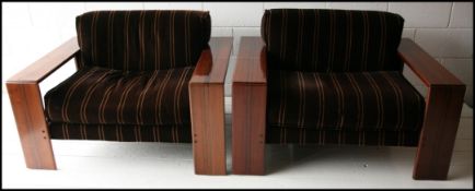 A rare pair of 1970s ' Artona ' dark wood armchair