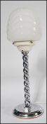 A 1930's Art Deco chrome barley twist table lamp. Circular base with flicker switch with white glass