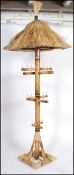 An unusual large bamboo thatched cocktail bar tahiti inspired upright display stand. The upright