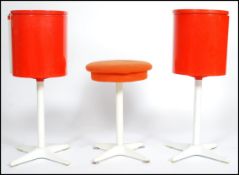 A pair of 1970's retro space age orange lollypop dressing tables. Each of cylindrical form with