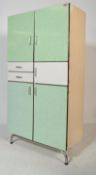 A 1950's retro vintage French pantry larder kitchenette cabinet in white raised on metal legs with