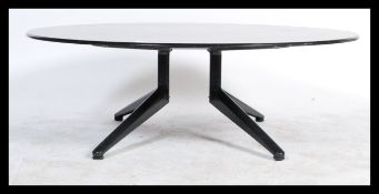 Bas Pruyser - Ahrend 22 - A large round executive / conference coffee table having a wooden