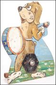 A retro vintage hand made and painted steel fairground shooting target depicting a drumming dog when