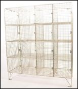 A retro 20th century contemporary freestanding galvanised steel framed sixteen divisional gym locker