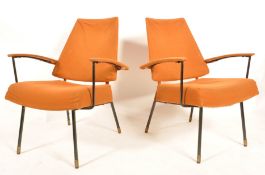 An unusual French mid Century pair of retro vintage easy / lounge chairs / armchairs having an