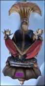 A decorative 20th century composite oriental twin headed wall lamp of decorative form. The