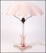 An Art Deco antique vintage table lamp having a large parachute type shade supported by a square