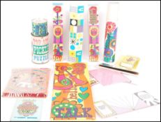 An Assorted collection of Pop art and Psychedelic graphic packaging to include puzzles , games
