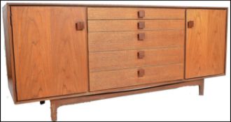 Ib Kofod Larsen - A superb Danish Credenza sideboard. The sideboard  being raised on teak tapering