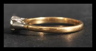 An 18ct gold and diamond solitaire ring set with a