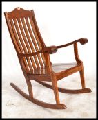 A 20th Century Hardwood antique style rocking chai