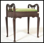 An early 20th century Edwardian mahogany piano sto