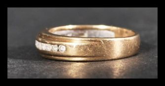 A hallmarked 9ct gold and diamond half eternity ri