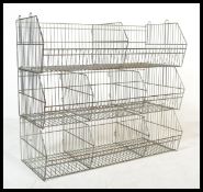 A retro 20th century Industrial wirework shop - grocers display stand.  The modular stacking