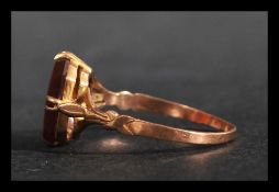 A 9ct gold ring having a prong set carnelian with