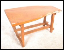 A retro mid 20th Century live edge elm topped coff