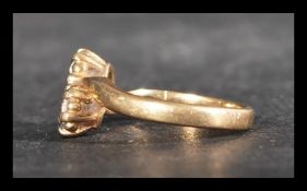 A hallmarked 9ct gold and diamond ring having star