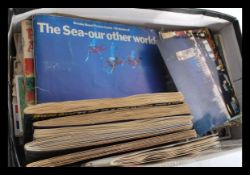 A collection of vintage tea cards in albums and lo