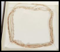 A group of sterling silver necklaces to include an