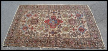 An early 20th century hand woven floor carpet rug