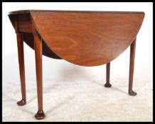 A 19th century Georgian mahogany drop leaf dining