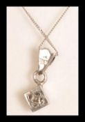 A 9ct white gold pave set diamond necklace pendant