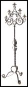 A 20th century wrought metal ebonised standard lam