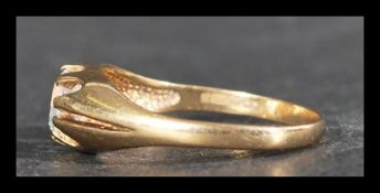 A hallmarked 9ct gold ring set with a large CZ sto