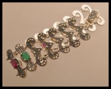 A sterling silver marcasite bracelet of scrolled f