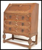 A 1930's Edwardian oak bureau, fall front with app
