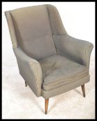 A mid century armchair in the manner of Robin Day