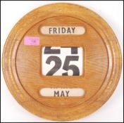 An Art Deco retro vintage round oak cased perpetua