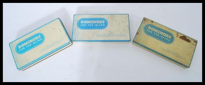 A collection of 3 mid century tin cased Braille Dominoes for the Blind games sets. Each with