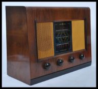 A vintage 20th Century wooden cased Bush Type DAC 11 valve radio.