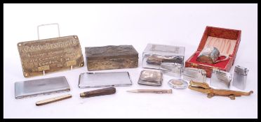A good collection of vintage cigarette lighters and cases to include silver hallmarked damaged case,