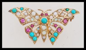 A vintage hallmarked 9ct gold opal, ruby and turquoise brooch in the form of a butterfly. Makers HBJ