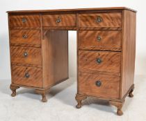 A 19th century satin maple wood kneehole writing desk. Raised on cabriole stub legs with pad feet.