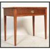 A 19th century Georgian mahogany writing table desk raised on tapered square legs with pull out