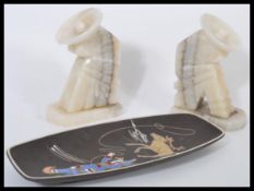 A pair of retro 20th Century onyx book ends in the form of seated Mexicans wearing sombreros
