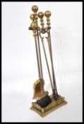 A 19th century brass fireside compendium set in original cast brass stand. Please see images.