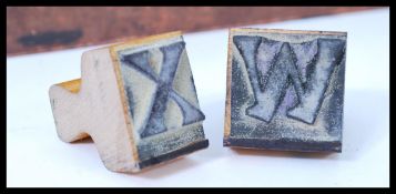 A vintage cased set of wooden ink printing letters punctuation and number,  superior sign marker set