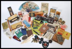 A good collection of vintage items to include a bakelite desk tidy, ink pens, lighters, cigarette