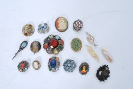 A collection of vintage costume jewellery brooches to include names pieces, cameo, rhinestone etc.