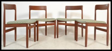 A set of four vintage retro 20th century teak wood dining chairs by Younger UK having shaped back