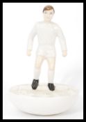 A Royal Doulton Subbuteo ceramic football figurine MCL 12 featuring a player in white kit on white