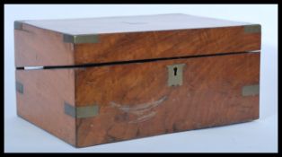 A 19th century Victorian mahogany writing slope box having brass mounts with plain armorial